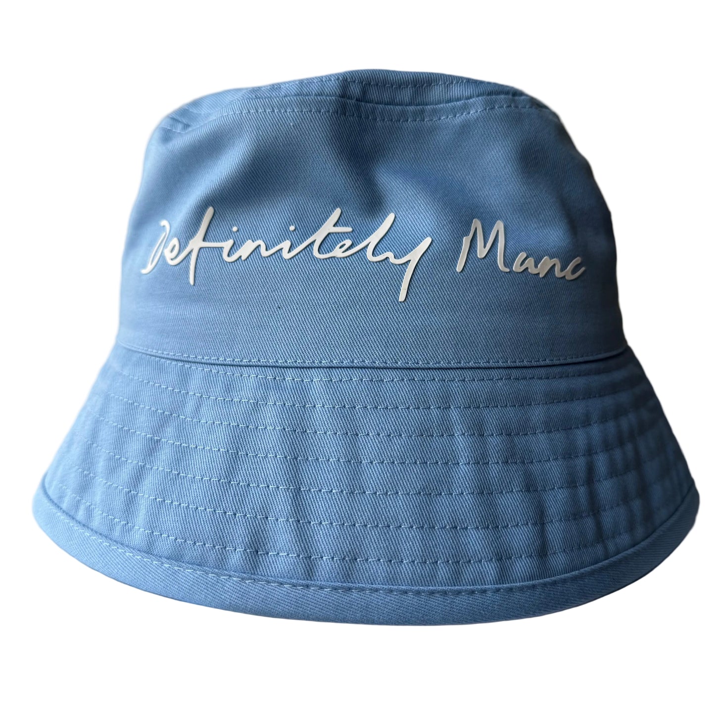 Blue bucket hat with 'Definitely Manc' text on a white surface.
