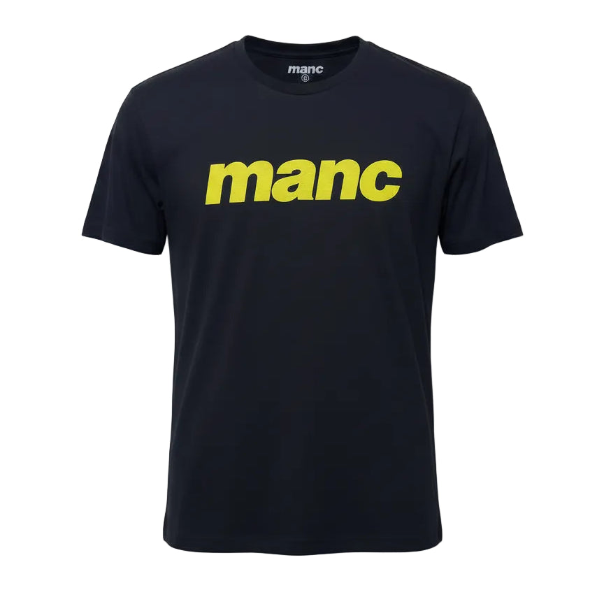 black t-shirt with the word 'manc' written on it in a yellow puff vinyl against a white backdrop
