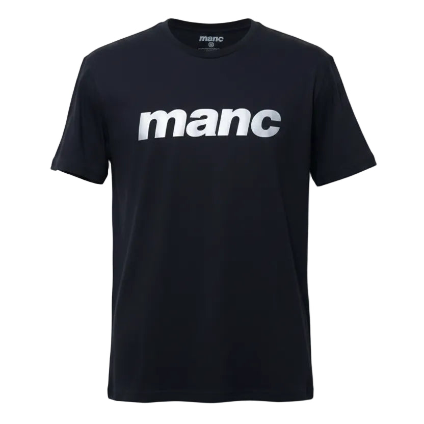 Black t-shirt with 'manc' text in reflective vinyl on a hanger against a white background