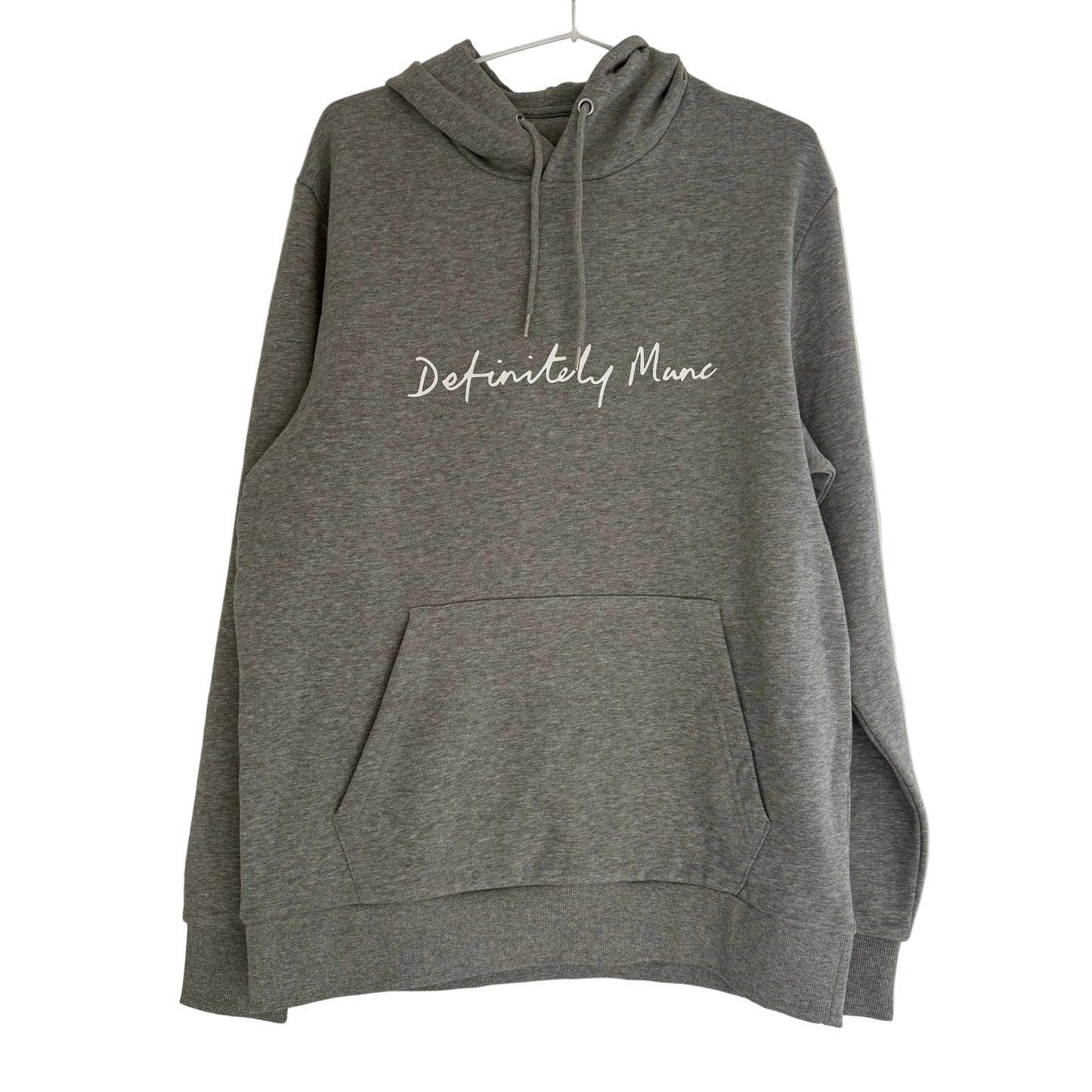 Grey hoodie with 'Definitely Manc' text on a white background