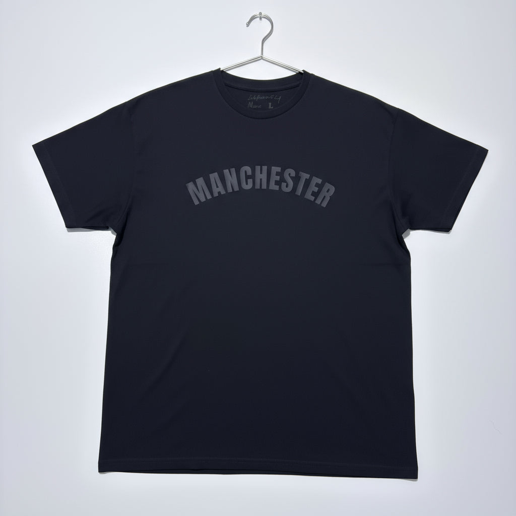 Black t-shirt with 'MANCHESTER' text on a white background