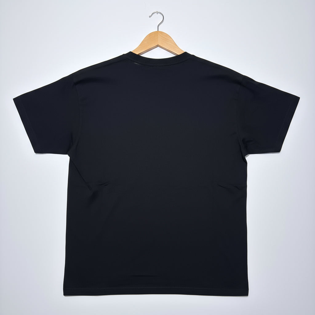 Black t-shirt on a wooden hanger against a white background