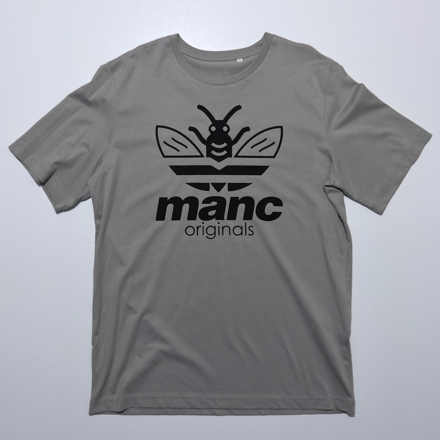 Grey t-shirt with black logo and text on a light grey background