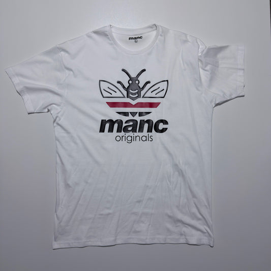 White t-shirt with 'manc originals' logo on a grey background