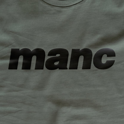 Forest Green t-shirt with 'manc' printed in black 