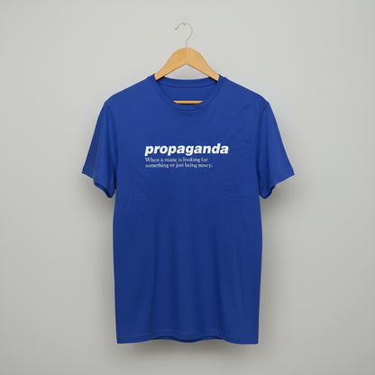 Blue t-shirt with white text on a hanger against a grey background