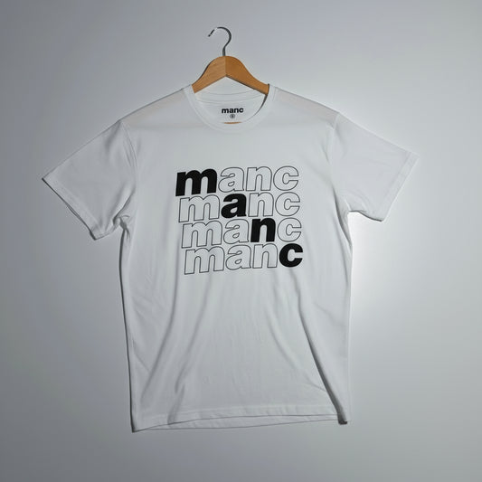 White t-shirt with 'manc' text design on a hanger against a grey background